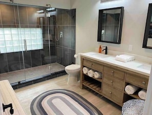 Shower, hair dryer, towels, soap