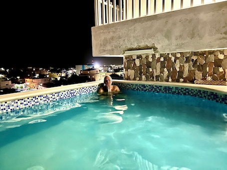 Pool. Romantic Hispanic 304 private room with refrigerator and dining area.