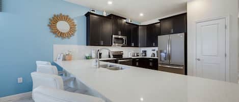 Coffee/tea maker, fridge, microwave, oven