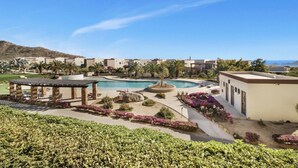A resort with a swimming pool, outdoor seating, and a view of the ocean. - Best Cabo Bay View, Quite, Ventanas (Cabo San Lucas)