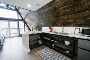 Fridge, microwave, stovetop, coffee/tea maker