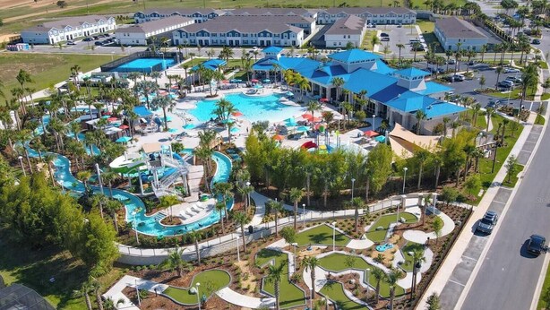 An aerial view of a resort with multiple swimming pools, a water park, and a variety of landscaped areas. - Grand Marvel & Star Wars Villa | Windsor Island (Davenport)