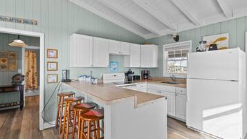 Fridge, microwave, stovetop, coffee/tea maker