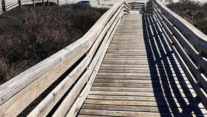 A wooden boardwalk leading to a beach with a clear view of the ocean. - Private Heated Pool, Golf Cart Included, Pet Friendly (Port Aransas)