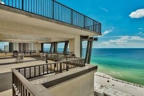 Relax on the spacious outdoor terrace with ocean views and comfortable seating.