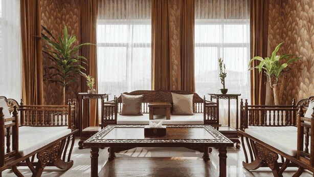 A spacious room with a large sofa set, a coffee table, and two side tables. - 8008 Hotel (Phnom Penh)