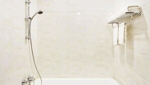 A bathroom with a shower, a towel rack, and a bathtub. - 8008 Hotel (Phnom Penh)