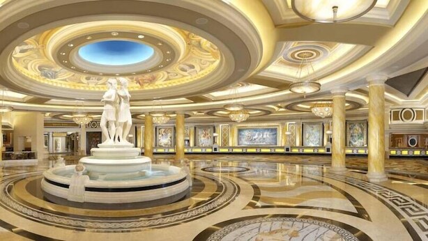 A luxurious lobby with a central fountain, ornate ceiling, and marble flooring. - Suite + Connecting Room at a 4.5⭐️ Hotel (Las Vegas)