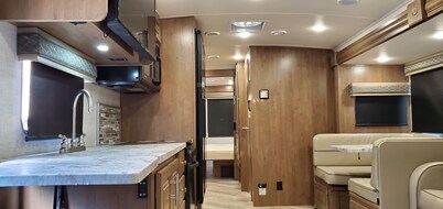 Class A RV on a private 5 Acre Property with RV campsite and trail.