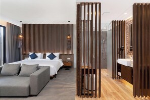 Deluxe Suite with Balcony | Bathroom | Rainfall showerhead, hair dryer, bathrobes, slippers