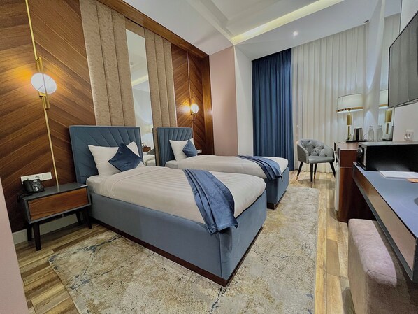 Premium bedding, down comforters, pillowtop beds, minibar