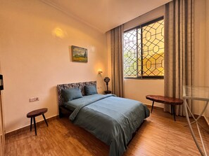 Comfort Room | Individually decorated, individually furnished, blackout drapes - Greedy Five (Kigali)