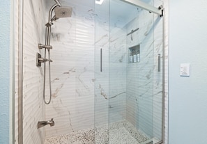 Shower, eco-friendly toiletries, hair dryer, towels