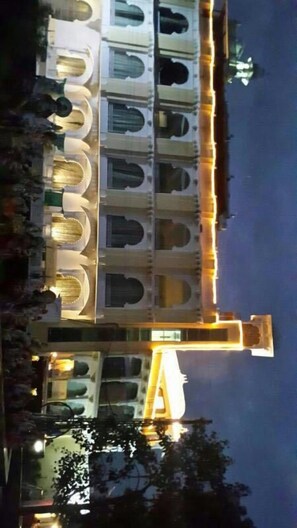 A building with multiple balconies and a central structure. - Hotel Vishalas The Raj Kesar Regency (Udaipur)