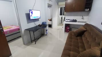 Family Apartment, 2 Bedrooms | Living area | 32-inch LED TV with digital channels, TV, Netflix