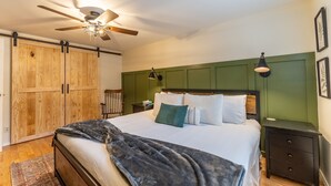 A bedroom with a bed, a ceiling fan, a nightstand, and a wardrobe. - Close to Main Street, Access to Nearby Ski Resorts; Private Patio! (Frisco)