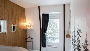 1 bedroom, desk, iron/ironing board, travel crib