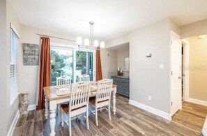 Dinning area with access to outdoor patio - Escape at Sun Beach Club NSB (New Smyrna Beach)