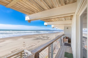 A wooden deck with a view of the beach and ocean. - Sand Dollar Beachfront Home, Direct Beach Access! (La Selva Beach)