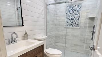 Hair dryer, towels, soap, toilet paper