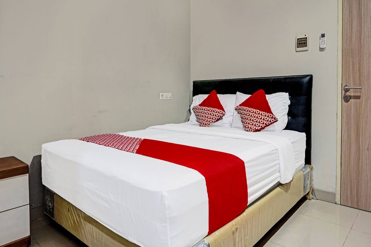Laptop workspace, bed sheets