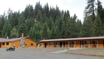 Escape to a secluded forest retreat in our cozy cabins, each with a stone chimney.