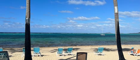 On the beach, sun-loungers