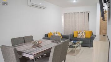 Deluxe Townhome | Private kitchen | Full-size fridge, microwave, oven, blender