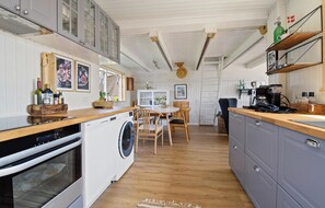 Fridge, stovetop, dishwasher, coffee/tea maker