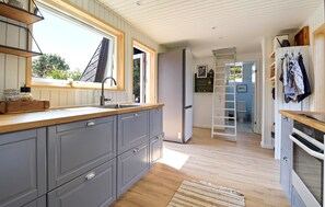 Fridge, stovetop, dishwasher, coffee/tea maker