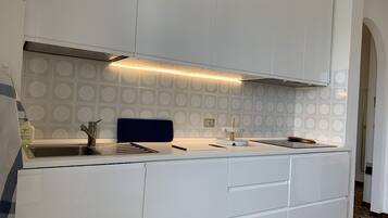 Fridge, stovetop, coffee/tea maker, cookware/dishes/utensils