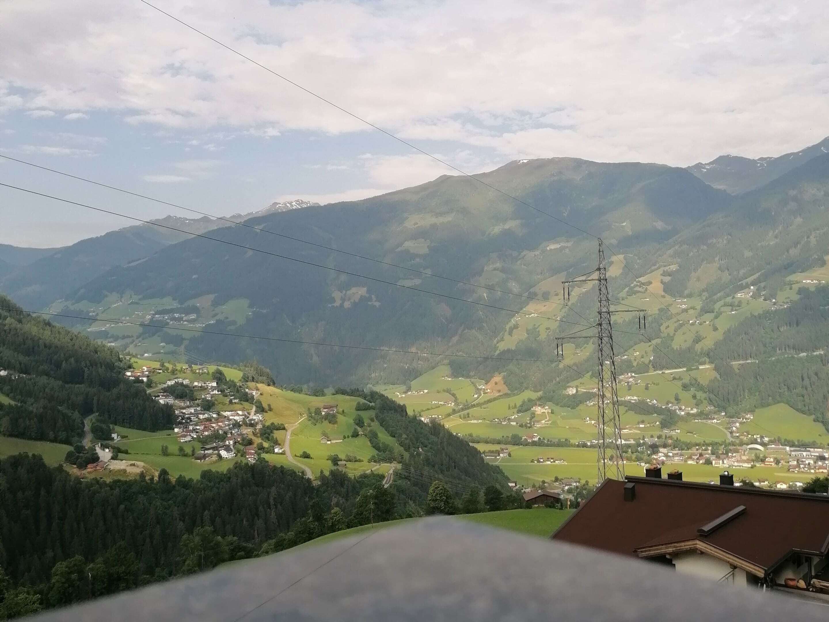 A mountainous landscape with a village nestled in the valley.
