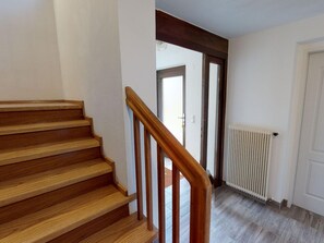 A wooden staircase with a handrail leading to a door. - Holiday Home Bodensdorf Near Ski & Lake (Steindorf am Ossiacher See)