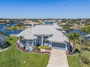 Exterior - This Villa has it all! Waterfront - boat dock, tiki hut, hot tub, sauna & pool! (Cape Coral)