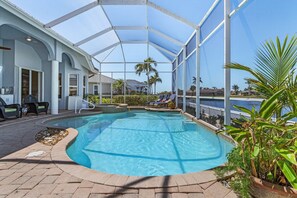 A heated pool - This Villa has it all! Waterfront - boat dock, tiki hut, hot tub, sauna & pool! (Cape Coral)