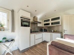 House | Private kitchen | Highchair - Cosy Holiday Home in Appelscha With Garden (Appelscha)