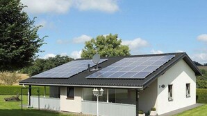 A single-story house with a sloped roof, solar panels, a covered porch, and a satellite dish. - Holiday Home in Gonnersdorf With Sauna (Gonnersdorf)