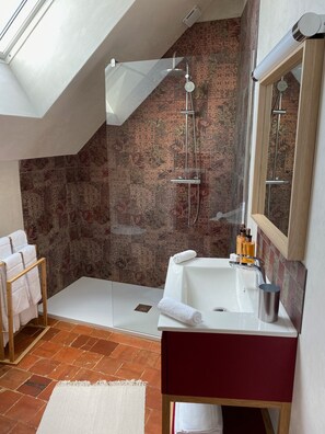 Shower, hair dryer, towels, soap