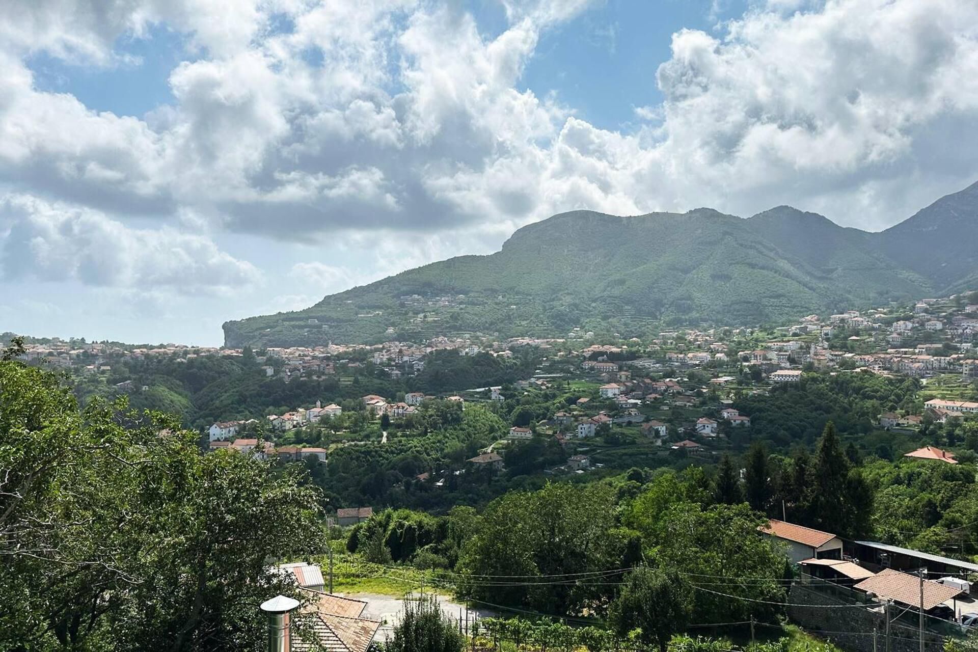 A mountainous landscape with a town nestled in the valley.