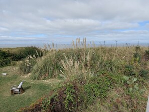 House, 4 Bedrooms | Property grounds - Beach Front On The Bay In Our Rustic, Pet Friendly Cottage 4 Bedroom Cottage by RedAwning (Norfolk)