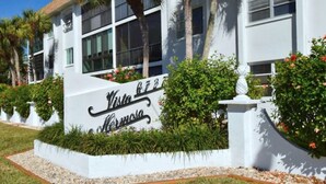 A building with a sign that reads 'Vista Hermosa.' - VH 206C (Siesta Key)