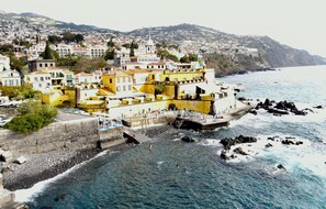Beach nearby, black sand, sun loungers, beach umbrellas