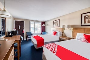 A hotel room with two beds, a desk, a chair, a coffee machine, and a window. - Hotel Wadsworth OH I-76 (Wadsworth)