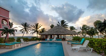 Beachfront condo with beach access, dock, pool, balcony, & ocean views