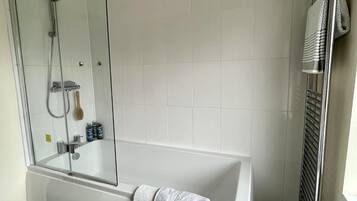 Bathtub, hair dryer, towels