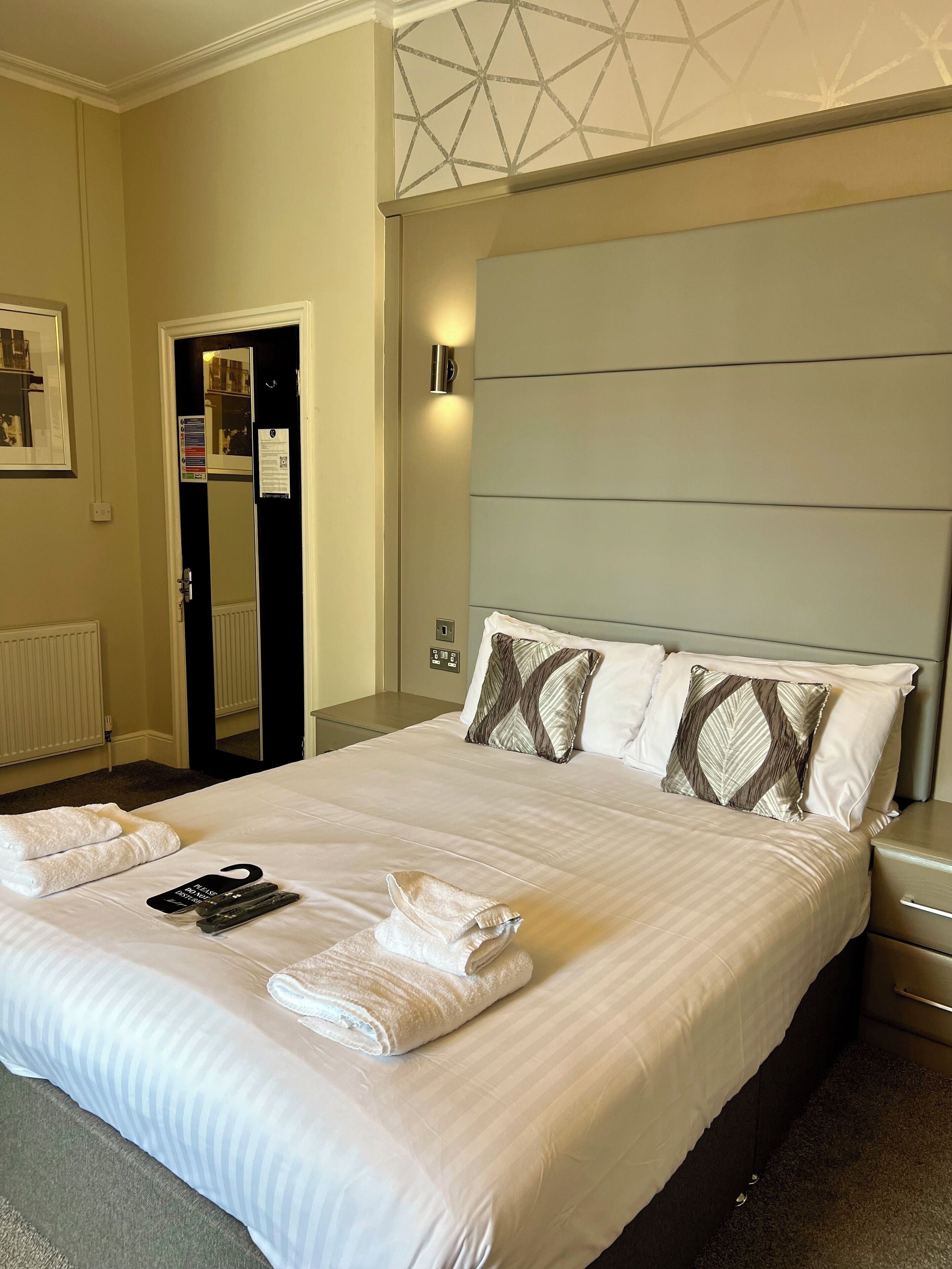 Premium bedding, desk, laptop workspace, blackout curtains