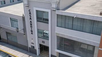 A multi-story building with a prominent 'CASA ANDINA' sign on the facade.