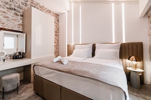 Habitación superior | Ropa de cama de alta calidad y edredones de plumas