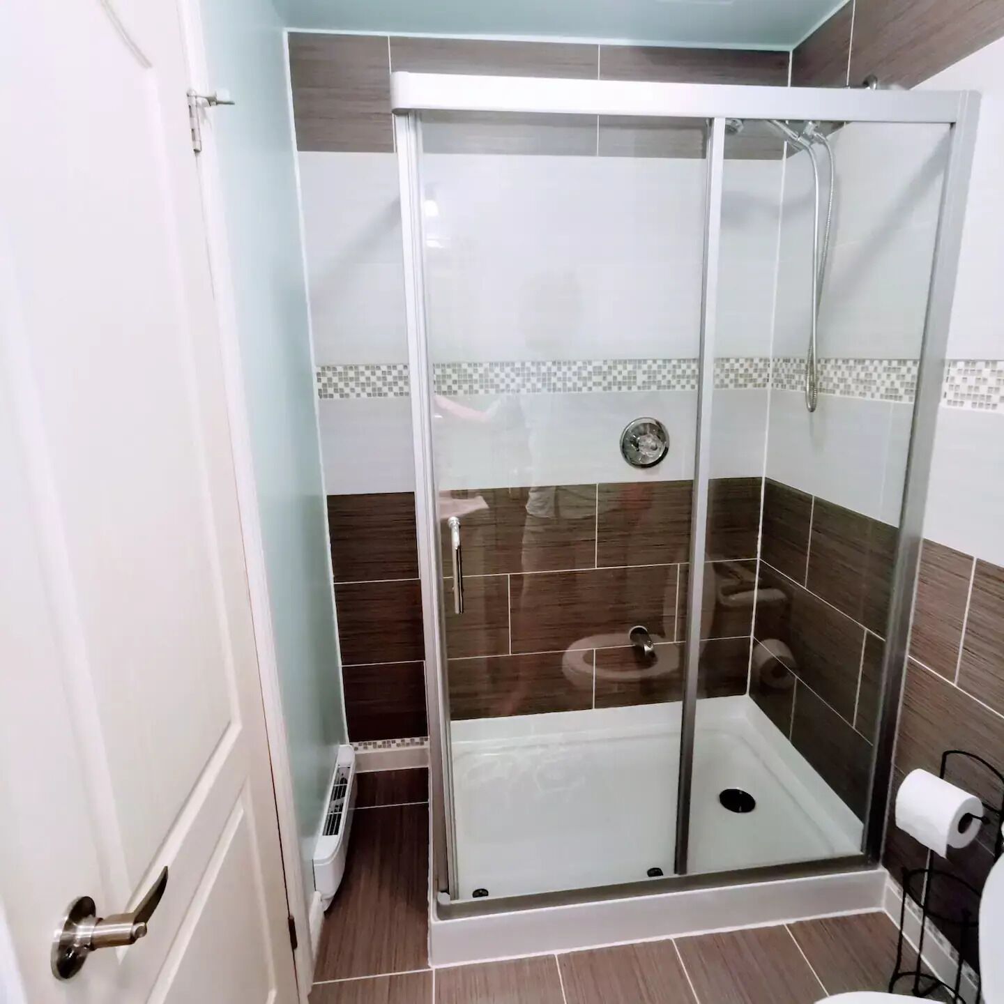 Shower, hair dryer, towels, toilet paper