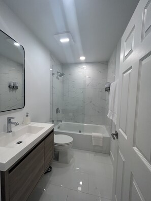 Shower, hair dryer, towels, soap